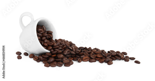 Coffee beans and overturned cup isolated on white