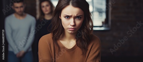 Humiliating moment Displeased young woman upset by nearby young adults flirting