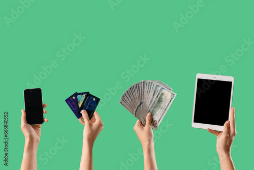 Women with gadgets, credit ...