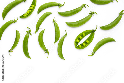 Fresh young green peas on white background.
