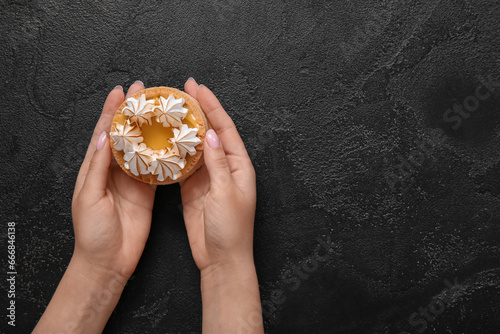 Female hands holding a deli...