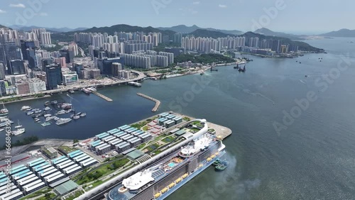 Drone Aerial Skyview of Royal Caribbean Spectrum of the seas Mega Luxury Cruise Ship dock anchor in Commercial construction development project in Kai Tak Sports Park Cruise Terminal in Kwun Tong Kowl photo