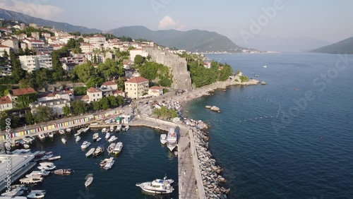 Aerial: Jadran pool view, Škver Harbor, Herceg Novi, Montenegro. Moored boats photo