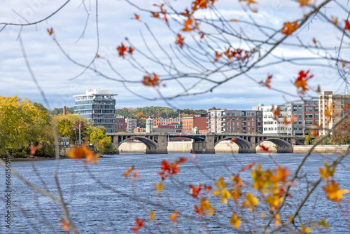Fototapeta Naklejka Na Ścianę i Meble -  A view of the Haverhill skyline of the bridge and tall modern buildings. This small city in New England is brick and glass buildings. Haverhill Massachusetts MA during the fall and autumn with leaves