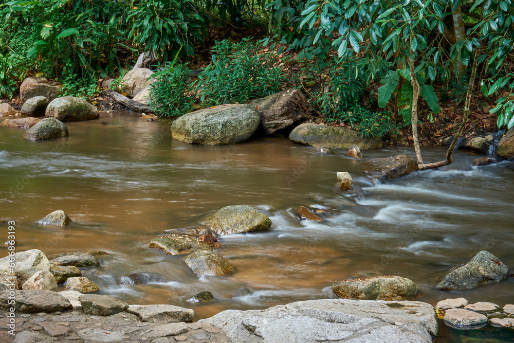 Natural water stream and rocks Natural water stream and rocks