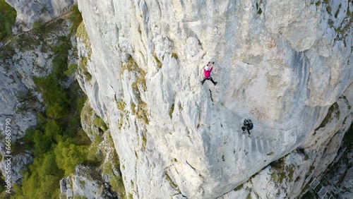 Two Female climbers mountaineering, via ferrata in 
