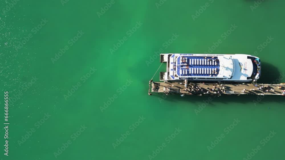 4K Aerial Panning Over Passengers Boarding The Lomprayah High Speed Ferry At Pralarn Pier. A Busy Port Destination In Maenam, Koh Samui Connecting Travelers To Other Local Islands.