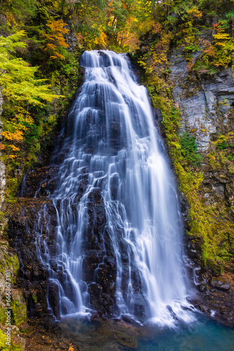 waterfall in autumn forest