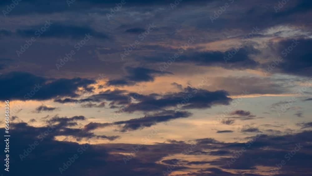 Time lapse of the beautiful scenery of the sunset sky with the golden rays of the sun against the background of the silhouette of the mountain landscape. Natural landscape background. Time lapse of the beautiful scenery of the sunset sky with the golden rays of the sun against the background of the silhouette of the mountain landscape. Natural landscape background.