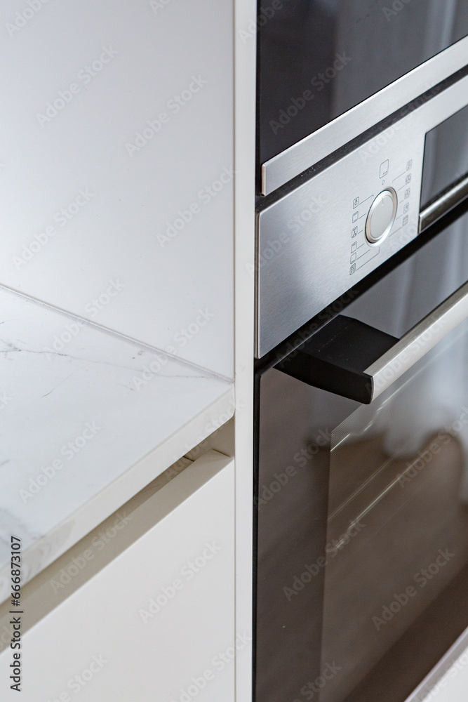 Closeup of a marble bench top and oven. Closeup of a marble bench top and oven.