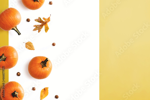Autumn pumpkins with leaves - overhead view flat lay