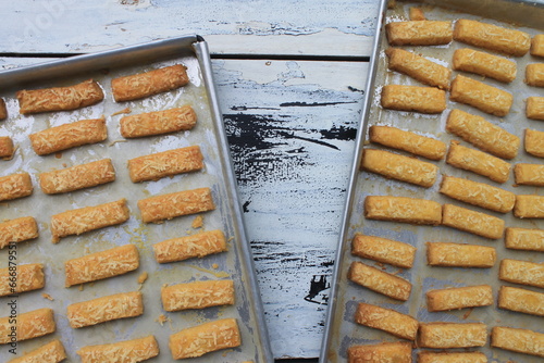 Rows of Indonesian cakes called kastangel on a table ready to serve photo