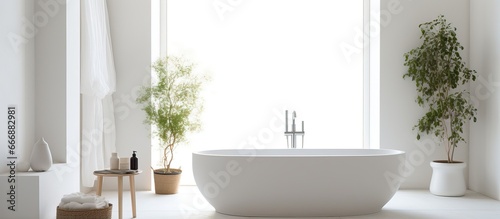 Attractive restroom featuring large tub and bright walls