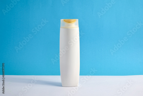White Bottle shampoo blank for mock up with blue background, beauty health care mockup bottle.