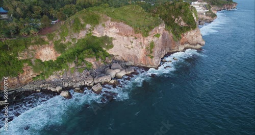 Waves Crashing on Yogyakarta Island Sea Cliffs on Bali Ocean Coastline, Aerial photo