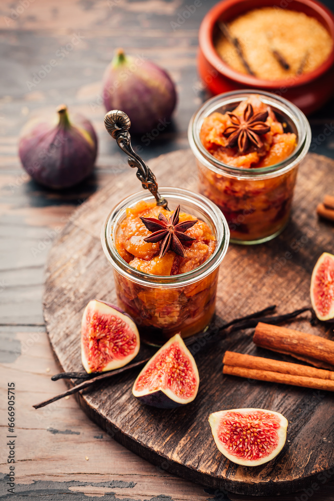 Homemade fig jam or jelly in a jar with cinnamon, vanilla and brown sugar