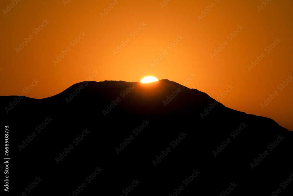 Sun rising at dawn over the mountains in Cabo de Gata, Almeria Sun rising at dawn over the mountains in Cabo de Gata, Almeria