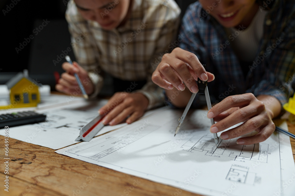 Meeting engineers or architects for projects working with partners and engineering tools on modeling. Using circles to design blueprints construction contracts between two companies structure concept Meeting engineers or architects for projects working with partners and engineering tools on modeling. Using circles to design blueprints construction contracts between two companies structure concept