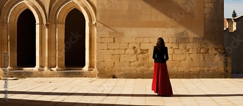 Woman visiting Santa Mar a la Real church in Aranda de Duero Burgos Spain from behind photo
