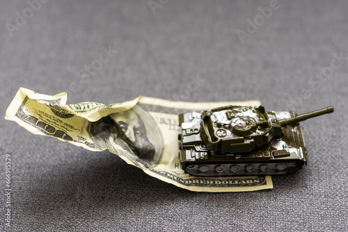 toy tank and dollars, army token