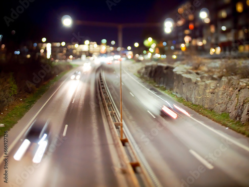 Long exposure tilt shift image of traffic passing on a highway..