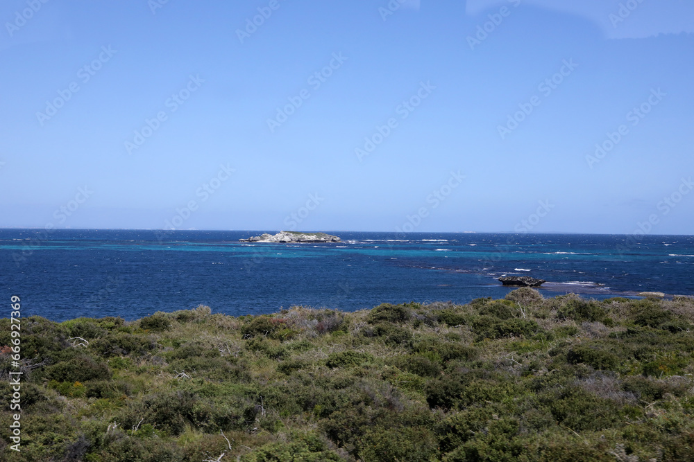 Beautiful coastal image of Rottnest Island off the West Australian coast.  Showing clear water, waves, limestone rocks and vegetation