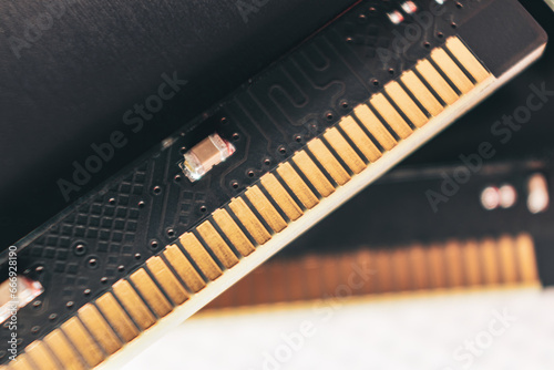 DDR4 DRAM memory module golden electrical contact macro. Computer RAM chipset hardware close-up. Desktop PC memory parts for assemble