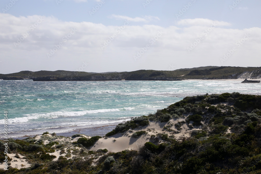Beautiful coastal image of Rottnest Island off the West Australian coast.  Showing clear water, waves, limestone rocks and vegetation