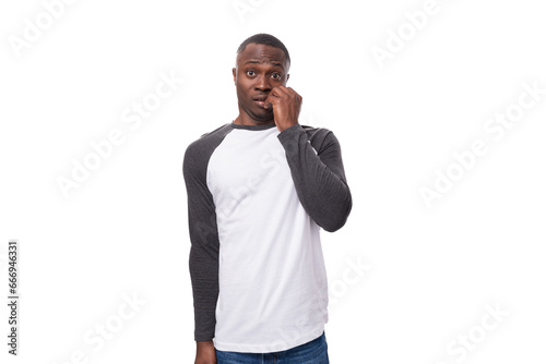 young american man with short haircut dressed in long sleeved casual sweatshirt inspired by idea on isolated white background