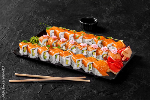Фотография Set of Philadelphia rolls with fresh and torched salmon