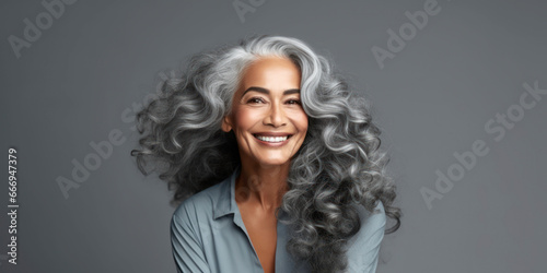 . Gorgeous aging mature woman with long gray hair and happy smiling. AI Generative