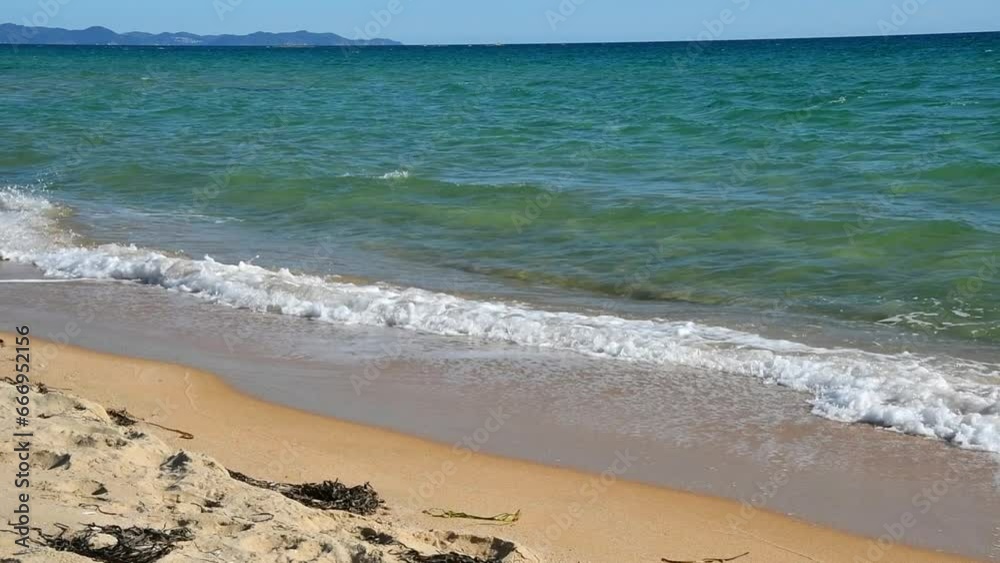 Ocean waves rush onto a sandy beach. Beautiful peaceful sea landscape. Ocean waves rush onto a sandy beach. Beautiful peaceful sea landscape.