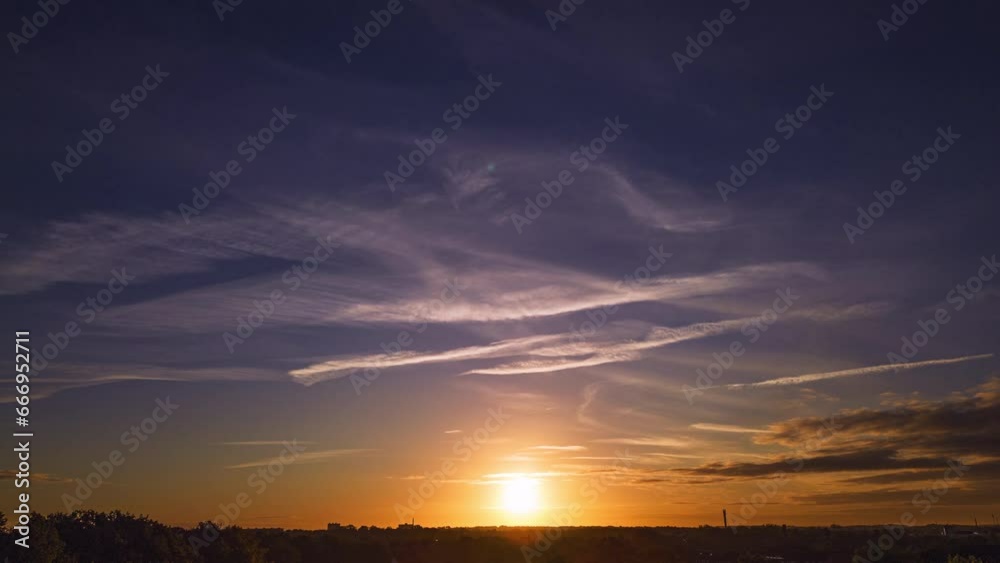 Sunrise with blue sky and little fluffy clouds over suburban aerea Sunrise with blue sky and little fluffy clouds over suburban aerea