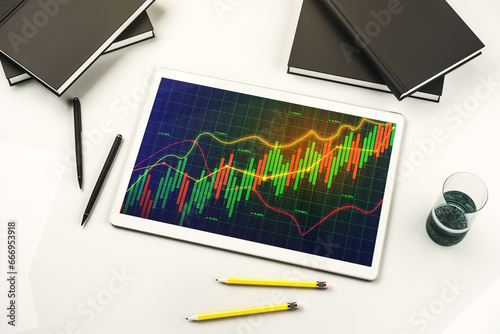 Modern digital tablet display with abstract financial graph, financial and trading concept. Top view. 3D Rendering