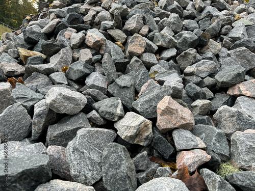 Grey crushed stones in close up. Building material for horticulture, landscape gardening or road construction. Material for railroad construction