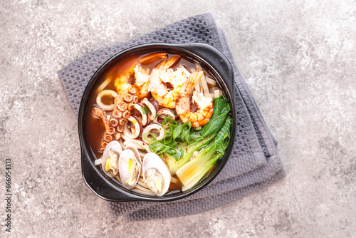 Jjampong is Red Spicy Seafood Korean Noodle Soup with Vegetable, Shrimp, Octopus and Clam.