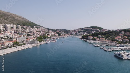 Dubrovnik Port: Yachts, city backdrop, Adriatic's shimmering embrace - Aerial