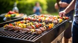 A person grilling barbecue skewers at a backyard cookout