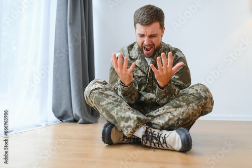 Portrait of middle aged sad, desperate military man. PTSD concept. Horizontal shot