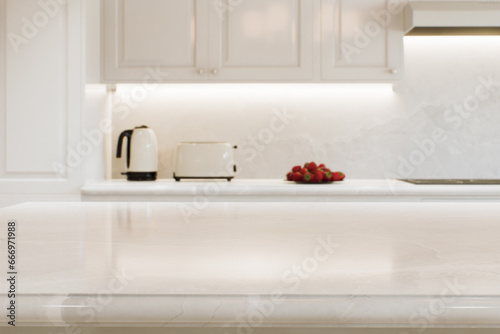 Kitchen white countertop with white marble, with blurred bokeh background. 