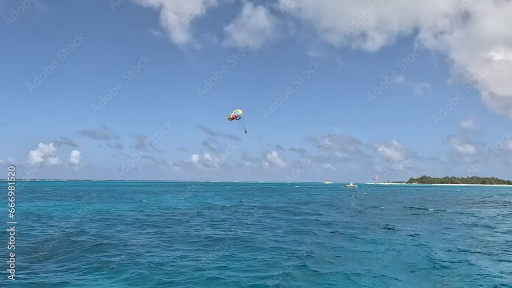 Chase after paragliding soaring high in the sky Chase after paragliding soaring high in the sky
