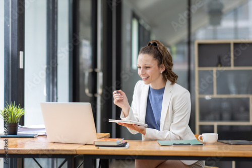 Confident millennial Canada female business analyst financial advisor preparing statistic report studying documents on work, finance analysis graph chart corporate economy, banking, market research