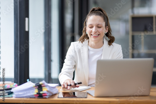 Confident millennial Canada female business analyst financial advisor preparing statistic report studying documents on work, finance analysis graph chart corporate economy, banking, market research