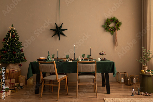 Interior design of christmas dinning room interior with table  christmas tree  chair  wreath  candle with candle stick  gifts  decoration  wooden consol and personal accessories. Family time Template.