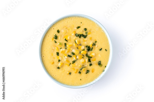 Corn soup in green bowl isolated on white background. Top view
