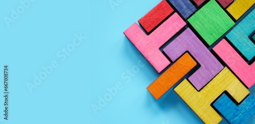 Obraz na płótnie Puzzle made of multi-colored pieces as a symbol of team integration, assistance and inclusiveness