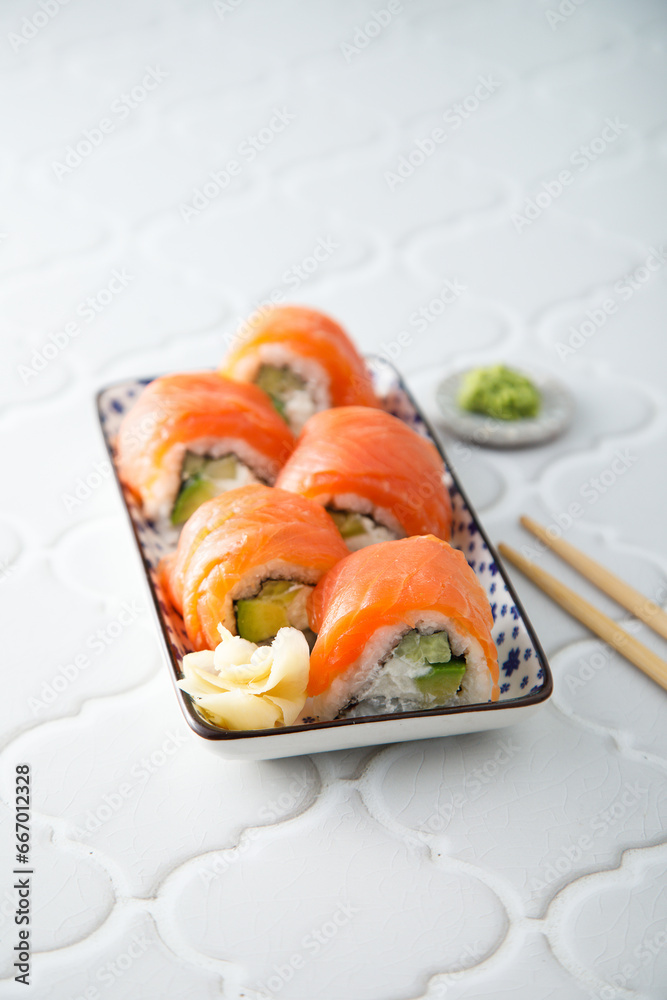Salmon sushi rolls with cucumber and avocado Salmon sushi rolls with cucumber and avocado