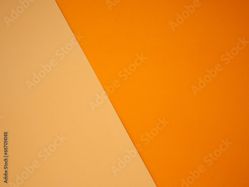 Top view for light orange and orange paper color for the background.