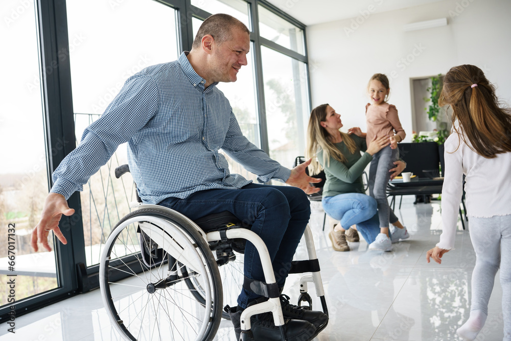 A father, facing physical challenges, engages in lively play with his family in the living room, creating cherished moments of joy and togetherness. A father, facing physical challenges, engages in lively play with his family in the living room, creating cherished moments of joy and togetherness.
