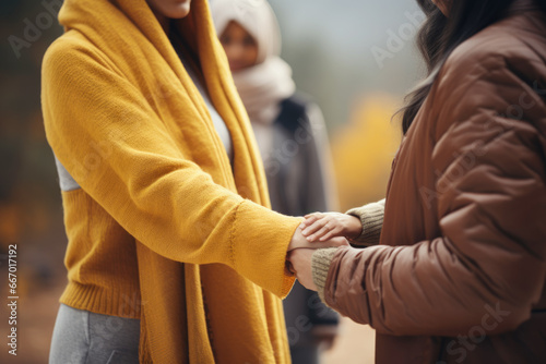 Diverse people holding hands supporting each other, shoving compassion and understanding 